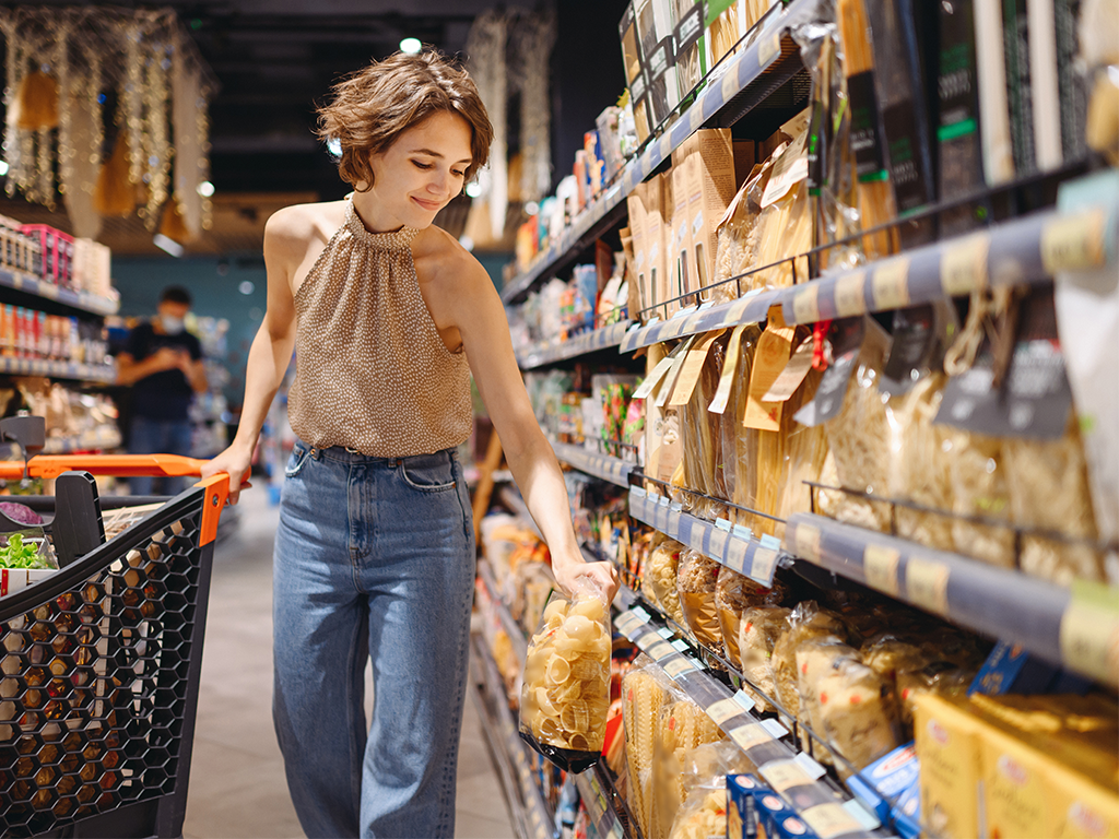 Woman dry pasta isle